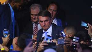 epa11247633 The former president of Brazil, Jair Bolsonaro (2019-2022), speaks to the press during the incorporation ceremony of Senator Izalci Lucas to the Liberal Party (PL) in Brasilia, Brazil, 27 March 2024.  EPA/Andre Borges