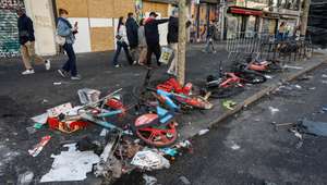epa13313419 Debris remains in the street in the aftermath of clashes between riot police and demonstrators during nationwide protests against the high cost of living in the country, in Paris, France, 18 October 2026.  EPA/MOHAMMED BADRA