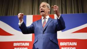 epaselect epa11379338 Honorary President of Reform UK Nigel Farage gestures while speaking at a press conference for the Reform UK party at the Glaziers Hall, London, Britain, 30 May 2024. Britain will hold a snap general election on 04 July 2024.  EPA/TOLGA AKMEN
