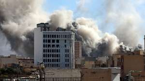 epa12786536 Smoke rises in central Tehran after an Israeli attack in Iran, 01 March 2026. A joint Israeli and US military operation continues on its second day after targeting multiple locations across Iran in the early hours of 28 February 2026, with Iran later launching retaliatory attacks.  EPA/ABEDIN TAHERKENAREH