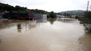 epa11641433 A flooded street following flash floods in Kiseljak, Bosnia and Herzegovina, 04 October 2024. Central and southern parts of Bosnia and Herzegovina were hit by a severe rainstorm overnight, which caused widespread flooding, closing roads, cutting electricity, and disrupting telecom signals. Rescue services in Jablanica and Kiseljak reported several people missing and called for army assistance, as access to Jablanica was completely blocked due to road and rail closures. 14 fatalities due to the flash floods have been confirmed so far by the regional government of Hercegovacko-Neretvanska county.  EPA/NIDAL SALJIC