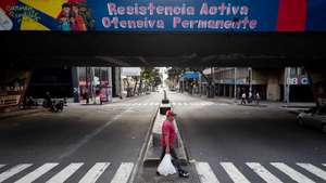 epa12626255 A man crosses a quiet street in Caracas, Venezuela, 04 January 2026. US forces captured Venezuelan President Nicolas Maduro and his wife, Cilia Flores, in a military operation on 03 January 2026. President Maduro and his wife were transported to New York following an indictment issued by the Southern District of New York.  EPA/RONALD PENA R