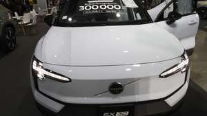 epa12478032 A potential customer inspects a Volvo EX30 electric vehicle at the Bangkok EV Expo 2025 in Bangkok, Thailand, 24 October 2025. The event showcases various electric car brands.  EPA/RUNGROJ YONGRIT