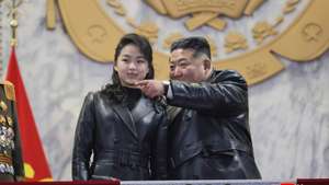 epa12777559 A photo released by the official North Korean Central News Agency (KCNA) shows North Korean leader Kim Jong Un (R) gesturing while his daughter Kim Ju Ae looks on during a military parade to celebrate the ninth congress of the ruling Workers' Party at Kim Il Sung Square in Pyongyang, North Korea, 25 February 2026 (issued 26 February 2026). The event marked the conclusion of the week-long Ninth Congress of the Workers' Party of Korea (WPK) in Pyongyang.  EPA/KCNA  EDITORIAL USE ONLY EDITORIAL USE ONLY