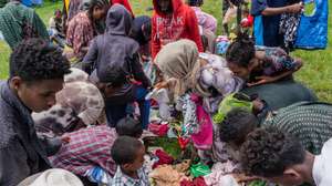 epa09421584 Ethiopian Internally Displaced Peoples (IDP's) who fled the fighting in the Tigray region collects clothes from local donors as they take shelter in a make-shift IDP camp at a school in Dessie, Ethiopia, 19 August 2021 (20 August 2021). According to Dessie government communications officer Mesaye Kider, 55,000 Ethiopians have fled from war torn Tigray region in the north and are taking shelter in makeshift camps. This occurred as the Tigray Peoples Liberation Front (TPLF) captured Alamata and Kobo area's in the war that has been going on with Ethiopia's national military.  EPA/STR