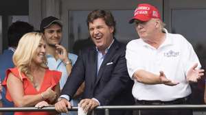 epaselect epa10100951 (L-R) Republican Congresswoman Majorie Taylor Greene of Georgia, Fox News television personality Tucker Carlson, and former US President Donald J. Trump watch the third round of the LIV Golf Bedminster invitational, part of the new LIV Golf Invitational Series, at the Trump National Golf Club in Bedminster, New Jersey, USA, 31 July 2022.  EPA/JUSTIN LANE