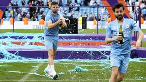 epa09968176 Portuguese players Ruben Dias (L) and Bernardo Silva of Manchester City celebrate after winning the English Premier League title following the English Premier League soccer match between Manchester City and Aston Villa in Manchester, Britain, 22 May 2022.  EPA/ANDREW YATES EDITORIAL USE ONLY. No use with unauthorized audio, video, data, fixture lists, club/league logos or 'live' services. Online in-match use limited to 120 images, no video emulation. No use in betting, games or single club/league/player publications