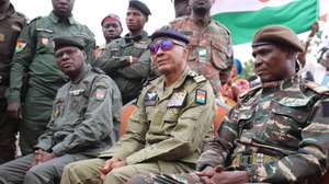 epaselect epa10894578 Members of the Niger military-run government (L-R) Police Deputy General Manager Assahaba Ebankawel, Colonel Sidi Mohamed and Colonel Ibroh Amadou Bacharou gather outside the French military base in Niamey, Niger, 01 October 2023. The gathering comes a few days after the departure of the French ambassador from the country. The French president announced on 24 September that France would withdraw its ambassador and military personnel from the country. The French military was yet to leave the Niamey base.  EPA/ISSIFOU DJIBO