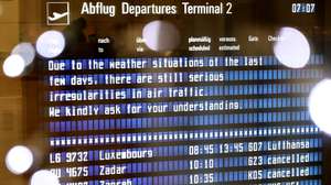 epaselect epa11011413 A board announces irregularities in air traffic due to winter weather conditions in Munich, Germany, 05 December 2023. Munich Airport's spokesman announced on the evening of 04 December that there would be no take-offs and landings on 05 December from the start of operations at 6 a.m. to 12 p.m, due to the freezing rain forecast. Flight operations at Munich Airport have been temporarily suspended over the weekend due to heavy snowfall.  EPA/ANNA SZILAGYI