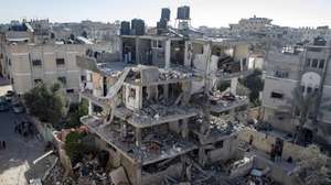 epa11242223 A general view shows damaged houses after an Israeli airstrike targeted the Rafah refugee camp, southern Gaza Strip, 25 March 2024. More than 32,000 Palestinians and over 1,450 Israelis have been killed, according to the Palestinian Health Ministry and the Israel Defense Forces (IDF), since Hamas militants launched an attack against Israel from the Gaza Strip on 07 October 2023, and the Israeli operations in Gaza and the West Bank which followed it.  EPA/HAITHAM IMAD
