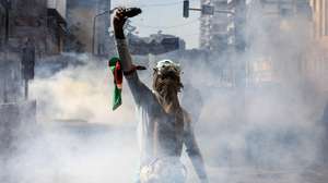 epa11435969 A demonstrator reacts during a protest against proposed tax hikes, in Nairobi, Kenya, 25 June 2024. Kenya's police on 25 June have sealed off the parliament and State House, and fired tear gas to disperse protesters demonstrating against planned tax hikes that many fear will worsen the cost-of-living crisis.  EPA/DANIEL IRUNGU