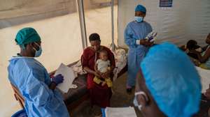 epaselect epa11551519 Medical staff attend to a woman and her baby treated for mpox at the Munigi Health Centre in Munigi, Democratic Republic of Congo on August 16, 2024. The European Centre for Disease Prevention and Control (ECDC) warned that Europe is likely to see more imported cases due to the virusâ€™s spread in several African nations after the World Health Organization declared the spread of mpox in Africa as a global health emergency.  Mpox belongs to the same family of viruses as smallpox but causes milder symptoms like fever, chills and body aches.  EPA/MOISE KASEREKA