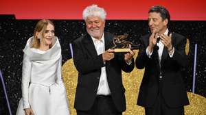 epa11591926 President of the Jury Venice 81, French actor Isabelle Huppert (L) and President of Italian Venice Biennale, Pietrangelo Buttafuoco (R), next to Spanish director and screenwriter Pedro Almodovar (C) as he holds the Golden Lion award for his movie 'The Room Next Door' during the closing ceremony of the 81st annual Venice International Film Festival, in Venice, Italy, 07 September 2024.  EPA/ETTORE FERRARI