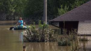 epa11609694 People use a raft in a flood-affected area following heavy rain in town of Ostrava, Czech Republic, 17 September 2024. Floods caused by heavy rains brought by Storm Boris have caused at least 18 dead across central and eastern Europe since 13 September, with three dead and seven missing in the Czech Republic.  EPA/MARTIN DIVISEK