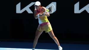 epa11832368 Iga Swiatek of Poland in action during her round three match against Emma Raducanu of Great Britain in the 2025 Australian Open tennis tournament in Melbourne, Australia, 18 January 2025.  EPA/Marcin Cholewinski POLAND OUT