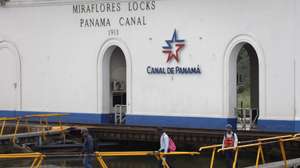 epa11840438 Workers walk by a sector of the Miraflores Locks of the Panama Canal, in Panama City, Panama, 20 January 2025. Panamanian President Jose Raul Mulino rejected the statement by US President Donald Trump during his inauguration speech to take back the Panama Canal.  EPA/Bienvenido Velasco