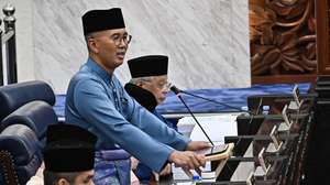 epa10228810 A handout photo made available by Malaysia's Department of Information shows Malaysia's Finance Minister Tengku Zafrul (C) speaking as he presents the 2023 budget at the parliament house in Kuala Lumpur, Malaysia, 07 October 2022. Finance Minister Tengku Zafrul Aziz has tabled Budget 2023, announcing an allocation of MYR 372.3 billion (81.23 billion euro)  EPA/Malaysia's Department of Information /Famer Roheni HANDOUT  HANDOUT EDITORIAL USE ONLY/NO SALES