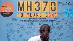 epaselect epa11196236 A family member of passengers and crew on board the missing Malaysian Airlines flight MH370 write on a memorial wall during a remembrance event marking the 10th anniversary of its disappearance at the Empire Subang in Subang Jaya, Selangor, Malaysia, 03 March 2024. About 200 people, including family members of missing passengers and Malaysia’s Transport Minister Loke Siew Fook, attended the memorial event marking the 10th year after Malaysia Airlines flight MH370, carrying 12 crew members and 227 passengers, disappeared on its way from Kuala Lumpur to Beijing on 08 March 2014.  EPA/NAZRI MOHAMAD