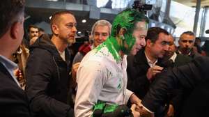 epa11186540 The president of the Democratic Social Party (PSD) Luis Montenegro (C) reacts after being hit with paint at his arrival at the Lisbon Tourism Fair (BTL) during a Democratic Alliance (AD) campaign, as part of the campaign for upcoming legislative elections, in Lisbon, Portugal, 28 February 2024. On January 15, the President of the Republic decreed the dissolution of parliament and the calling of early legislative elections on 10 March, following the resignation of Prime Minister Antonio Costa presented on 07 November 2023.  EPA/ANDRE KOSTERS