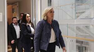 epa12001245 President of the National Rally (Rassemblement National, RN) parliamentary group, Marine Le Pen, leaves the Paris courthouse for the verdict in the case of the RN's parliamentary assistants in Paris, France, 31 March 2025. Le Pen and 24 other National Rally officials are on trial over accusations of misappropriating European Union funds. Prosecutors have requested a five-year prison sentence for Le Pen, a five-year ineligibility ban, and a fine of 300,000 euros. All defendants deny wrongdoing.  EPA/TERESA SUAREZ