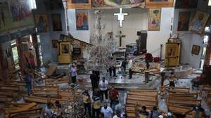 epaselect epa12191552 Emergency services work at the scene of a suicide bombing at Mar Elias Church on the outskirts of Damascus, Syria, 22 June 2025. Syrian authorities reported at least nine killed and 13 others injured in the attack, adding the suicide bomber was affiliated with the so-called Islamic State (IS or ISIS) terrorist organization.  EPA/MOHAMMED AL RIFAI