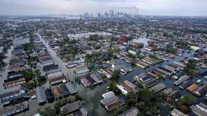 epa12326053 (FILE) - Aerial photograph of the devastation caused by the high winds and heavy flooding in the greater New Orleans area following Hurricane Katrina, Tuesday 30 August 2005 (reissued 27 August 2025). Hurricane Katrina was a devastating tropical cyclone that made landfall in Louisiana on 29 August 2005. The hurricane and subsequent flooding caused massive destruction along the coast of Louisiana, Mississippi, and Alabama impacting homes, business, infrastructure and environment.  EPA/VINCENT LAFORET *** Local Caption *** 00514557