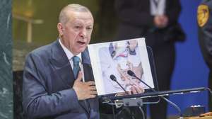 epa12400146 President of the Republic of Turkiye (Turkey) Recep Tayyip Erdogan holds a photo showing a malnurished child in the Gaza Strip, as he speaks during the General Debate of the 80th session of the United Nations General Assembly (UNGA) at the United Nations headquarters in New York, New York, USA, 23 September 2025.  EPA/SARAH YENESEL