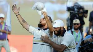 epa12413649 Shane Lowry of Europe (L) is congratulated by teammate Jon Rahm (R) after securing the Ryder Cup for Europe during the singles matches of the 2025 Ryder Cup golf tournament at the Bethpage Black Golf Course in Farmingdale, New York, USA, 28 September 2025.  EPA/ERIK S. LESSER
