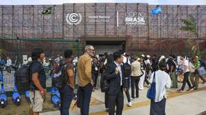 epa12518814 People wait to enter the Hangar Convention Center where COP30 is taking place in Belem, Brazil, 11 November 2025. Representatives from some 170 countries are participating in the 30th United Nations Climate Change Conference, COP30, which will run until November 21.  EPA/Andre Coelho