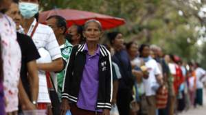 epaselect epa12584776 Displaced Thai villagers who fled from homes following clashes between Thai and Cambodian troops, wait for food distribution at a school turned into an evacuation center in Surin province, Thailand, 11 December 2025. Thai Prime Minister Anutin Charnvirakul on 09 December 2025 rejected a ceasefire with Cambodia, vowing full support for military operations along the Thai-Cambodian border until the threat against Thailand ended. The Royal Thai Army stated that tensions have continued to escalate after Cambodian forces fired approximately 5,000 rockets and suicide drones, a massive assault which has resulted in the displacement of over 500,000 civilians from both sides of the frontier.  EPA/RUNGROJ YONGRIT