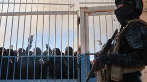 epaselect epa12667349 Members of the Syrian security stand in front of the gate of the Al-Hol camp, which houses families of suspected Islamic State (IS) group fighters, after the Syrian government took control of the area, in Hasakeh province, Syria, 21 January 2026. According to the Syrian Interior Ministry, security forces have entered al-Hol camp in Hasakah province to maintain stability following the withdrawal of Kurdish-led Syrian Democratic Forces (SDF) units and the temporary lack of guard presence.  EPA/MOHAMMED AL-RIFAI