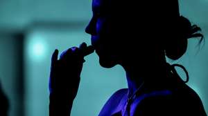 epa10729928 A person inhales a vape at a party in Caracas, Venezuela, 02 July 2023 (issued 06 July 2023). The order of the Venezuelan president Nicolas Maduro to evaluate the possibility of banning the sale of electronic cigarettes aroused the concern of sellers, who defend their use without opposing its regulation, and the expectations of the health sector, which supports the proposal for considering it preventive. The Pan American Health Organization (PAHO) stated that 'electronic cigarettes are the most common form of electronic nicotine delivery systems,' and that they 'threaten to upend decades of the fight against smoking.'  EPA/MIGUEL GUTIERREZ