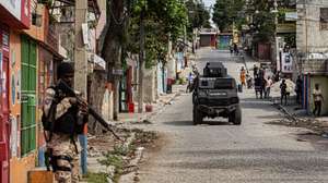 epaselect epa12714792 A member of the police guards an area in Port-au-Prince, Haiti, 07 February 2026. Prime Minister Alix Didier Fils-Aime said he was aware of the responsibilities he assumes as he takes executive power and pledged to get to work immediately.  EPA/Mentor David Lorens