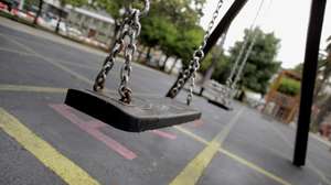 epa08486500 Swings are seen at a playground in A Coruna, Galicia, Spain, where children are finally allowed to use them as the region reaches the 'new normality', 15 June 2020. Galicia is Spain's first region that leaves behind the alarm status to start the so called 'new normality' in which face masks are obligatory in public spaces and common spaces such as playgrounds have a new capacity with a less amount of people to avoid crowded areas.  EPA/Cabalar