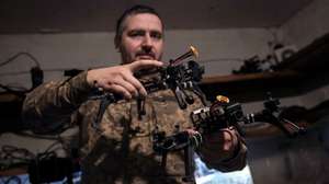 epa12844624 'Musician', Ukrainian drone pilot of the 93rd Brigade 'Kholodny Yar' shows several FPV (First Person View) unmanned aerial vehicles at the combat position where he works bringing down Russian drones, at an undisclosed location near the frontline in the Druzhkivka area (Donetsk), Ukraine, 23 March 2026. The Ukrainian Army now employs FPV to bring down other slower and more expensive unmanned vehicles that Russia's forces use for reconnaissance missions or to attack inside the cities located at the frontline.  EPA/Maria Senovilla