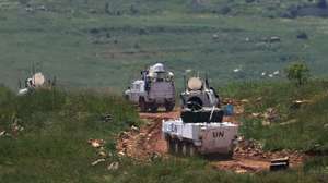 epa12921388 A United Nations Interim Force in Lebanon (UNIFIL) convoy leaving their base, in south Lebanon, as seen from the upper Galilee on the Israel-Lebanon border, 29 April 2026.  EPA/ATEF SAFADI