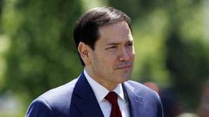 epa12951312 US Secretary of State Marco Rubio watches as US President Donald Trump talks to the media before leaving the South Lawn of the White House, Washington, DC, USA, 12 May 2026. President Trump is leaving the US to visit China where he will meet with President Xi in Beijing.  EPA/WILL OLIVER