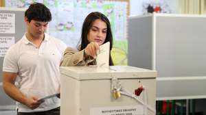 epaselect epa12989472 A woman casts her vote in the parliamentary elections at a polling station in Nicosia, Cyprus, 24 May 2026. Cypriots go to the polls to elect new members of the House of Representatives, for a five-year term.  EPA/George Christophorou