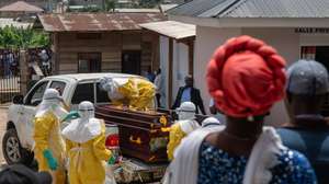 epa12987162 Health workers wearing full personal protective equipment (PPE) prepare to transport the body of an Ebola victim for a safe burial at Sofepadi Hospital in Bunia, Ituri province, Democratic Republic of the Congo, 23 May 2026. The World Health Organization (WHO) recently raised the national risk level of the virus's spread to 'very high' following a surge in cases. The outbreak, officially declared by the DRC Ministry of Health on 15 May, is driven by the Bundibugyo strain of the virus, for which there are currently no approved vaccines or specific therapeutic treatments.  EPA/STRINGER