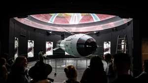 epa10940870 Visitors look at a scale model of the casing of the Tsar Bomba, the most powerful nuclear weapon ever created and tested, during a press tour of the new 'Atom' pavilion dedicated to Rosatom corporation at the All-Russian Exhibition Center (VDNH) in Moscow, Russia, 26 October 2023. The Atom exhibition pavilion is an educational complex with the largest and most modern exhibition in Russia dedicated to  the development of nuclear energy. The total area of the pavilion is 25,000 square meters, and can accommodate more than 2 thousand people at a time. The Atom Pavilion will open on 4 November 2023.  EPA/YURI KOCHETKOV