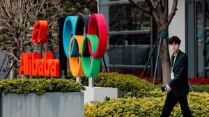 epa12832581 A man walks past Alibaba logo on their building in Xuhuibinjiiang Park, also known as 'AI Park,' home to many Chinese companies involved in AI (artificial intelligence) research, in Shanghai, China, 19 March 2026.  EPA/ALEX PLAVEVSKI