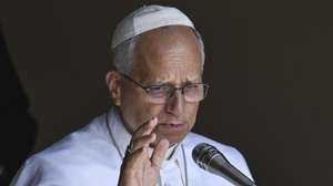 epa13133795 Pope Leo XIV delivers the Angelus prayer from the entrance of the Apostolic Palace overlooking Piazza della Liberta' at the Papal summer residence in Castel Gandolfo, near Rome, Italy, 26 July 2026.  EPA/RICCARDO ANTIMIANI