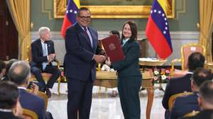 epa13207604 Chevron Venezuela President Mariano Vela (L) poses alongside Venezuela's Minister of Hydrocarbons, Paula Henao, after signing a document in Caracas, Venezuela, 02 August 2026. Venezuela's acting president, Delcy Rodriguez, stated after signing agreements with the multinational companies Chevron and Eni that she hopes the major oil agreement between Caracas and Washington announced on Friday will also benefit Americans, and said she is calling 'more and more every day' for dialogue with the White House.  EPA/RONLAD PENA R
