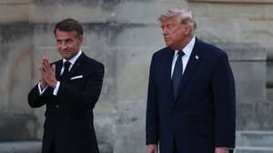 epa13045347 French President Emmanuel Macron (L) and his wife Brigitte Macron (not seen) welcome US President Donald J. Trump (R) at the Palace of Versailles in Versailles, west of Paris, France, 17 June 2026. Macron hosted Trump at Versailles after the G7 summit in Evian-les-Bains.  EPA/MOHAMMED BADRA