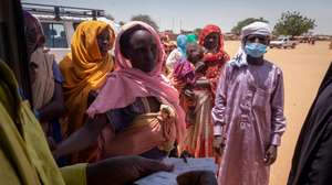 epa11275411 Workers of the World Food Programme (WFP) and Red Cross attend to refugees that have just arrived to Chad from Darfur, in a refugee camp in Adre, Chad, on the border with Sudan, 12 April 2024.  Most of the refugees are women and children fleeing the hunger crisis because of the war which started on 15 April 2023. According to the UNHCR in March 2024, in one year more than 500,00 Sudanese refugees, mainly from Darfur region, have crossed into Chad looking for safety, 90 percent of them are women and children. As different humanitarian crises are unfolding in other parts of the world, both the UN and NGOs like Doctors Without Borders/Médecins Sans Frontières (MSF) keep appealing for more aid to reach Sudan and avoid a looming famine situation in the already strained socio-economic context of Chad.  EPA/STRINGER