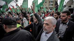 epa09065848 (FILE) - Hamas Gaza leader Yahya Al Sinwar (C) waves to supporters during a Hamas rally to mark the 31st anniversary of the group, in Gaza City, Gaza Strip, 16 December 2018 (reissued 10 March 2021). Sinwar was re-elected as Gaza Hamas leader on 10 March 2021.  EPA/MOHAMMED SABER *** Local Caption *** 54846862