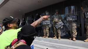 epa12167201 Protesters shout toward members of the California National Guard stationed in front of the Edward R. Roybal Federal Building in Los Angeles, California, USA, 09 June 2025. Approximately 2,000 National Guard troops were deployed on 08 June in Los Angeles by US President Donald Trump, though the state of California had not requested any additional assistance, and protests have continued against the Trump administration's immigration enforcement raids over the last couple of days.  EPA/ALLISON DINNER