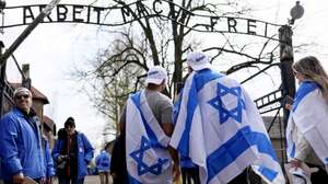 epa10578261 Participants in the March of the Living at the site of the former Auschwitz German concentration camp in Oswiecim, Poland, 18 April 2023. The march commemorates the victims of the Holocaust. Participants in the event walk along the "road of death" from the former German Auschwitz I camp to Auschwitz II-Birkenau.  EPA/Zbigniew Meissner POLAND OUT
