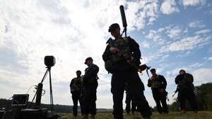 epa13192297 A soldier is equipped with a radio frequency detection system during exercise 'Saber Junction 26' in Hohenfels, Germany, 26 August 2026. Saber Junction is an annual Combat Training Center readiness and lethality validation exercise series for U.S. Army Europe and Africa's permanently assigned brigades. In 2026 the 173rd Mobile Brigade Combat Team is the primary training audience with approximately 3,360 troops training alongside other U.S.  U.S. Department of Defense units units and European allies and partners, for a total exercise participation of approximately 5,480 troops from August 15 to September 13.  EPA/ANNA SZILAGYI
