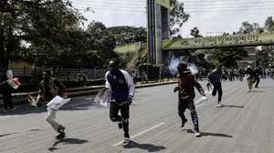 epa13063741 Protester run as they get dispersed with teargas outside the Central Police Station during a protest in the central business district of Nairobi, Kenya, 25 June 2026. The protest marks the second anniversary of the Gen Z protests, which culminated with the storming of the national parliament.  EPA/DANIEL IRUNGU